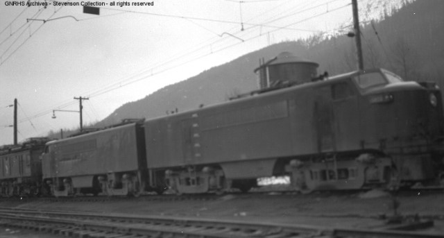 General Electric experimental, straight AC, 2500hp B-B electric locomotives at Skykomish, WA. Built  in 1952, 2 units were leased to the GN as demonstrators, but were purchased by PRR in 1953, joining their class E2B. Stevenson Collection, GNRHS Archives.