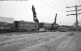 Cleanup of head on collision between local and standing through freight.