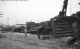 Upside down frame of RS3. Cleanup of head on collision between local and standing through freight.
