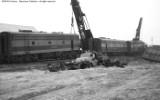 Cleanup of head on collision between local and standing through freight.