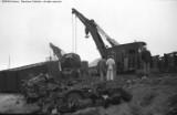 Cleanup of head on collision between local and standing through freight.