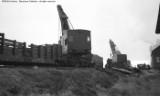 Cleanup of head on collision between local and standing through freight.